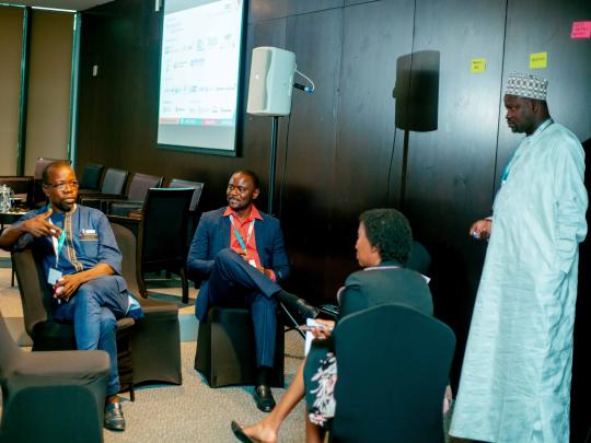 Balla Jatta from Gambia facilitates a group discussion at a workshop