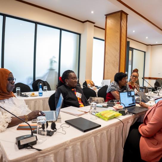 Program managers discuss with eachother during the Kikundi 2.0 meeting